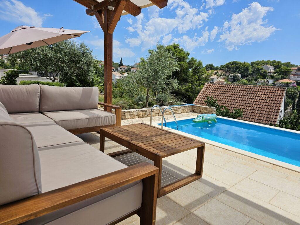 Relax on the comfortable couches next to pool